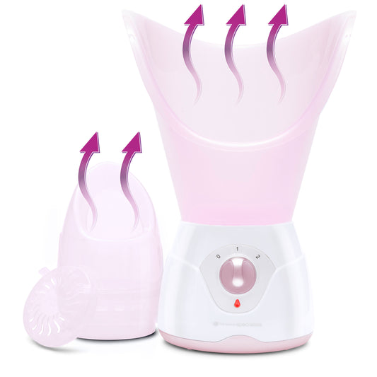The Rio Facial Sauna Skincare with Steam Inhaler in pink features a control dial, large steam funnel, and detachable parts. Purple arrows show steam from the main device and the smaller facial sauna attachment.