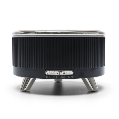 The Rio SONAS Aroma Diffuser, Humidifier & Night-Light is a black and silver cylindrical device with ribbed sides, metal legs, and labeled buttons for 1hr, 3hr, 6hr, and on/off—ideal for humidifying air or diffusing aromatherapy oils.