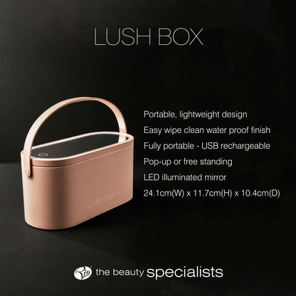 The Rio Lush Box Vanity Case in pink features a handle, mirrored LED lid, portable waterproof design, and USB rechargeability. Displayed against a dark background. Dimensions: 24.1x11.7x10.4 cm.